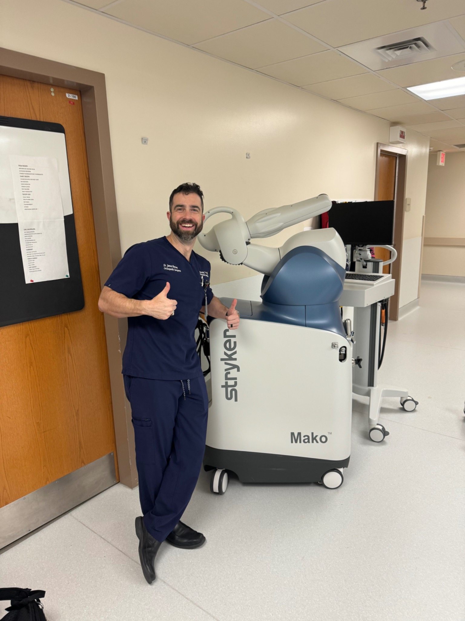 Dr. Barnes with Mako robotic surgery system