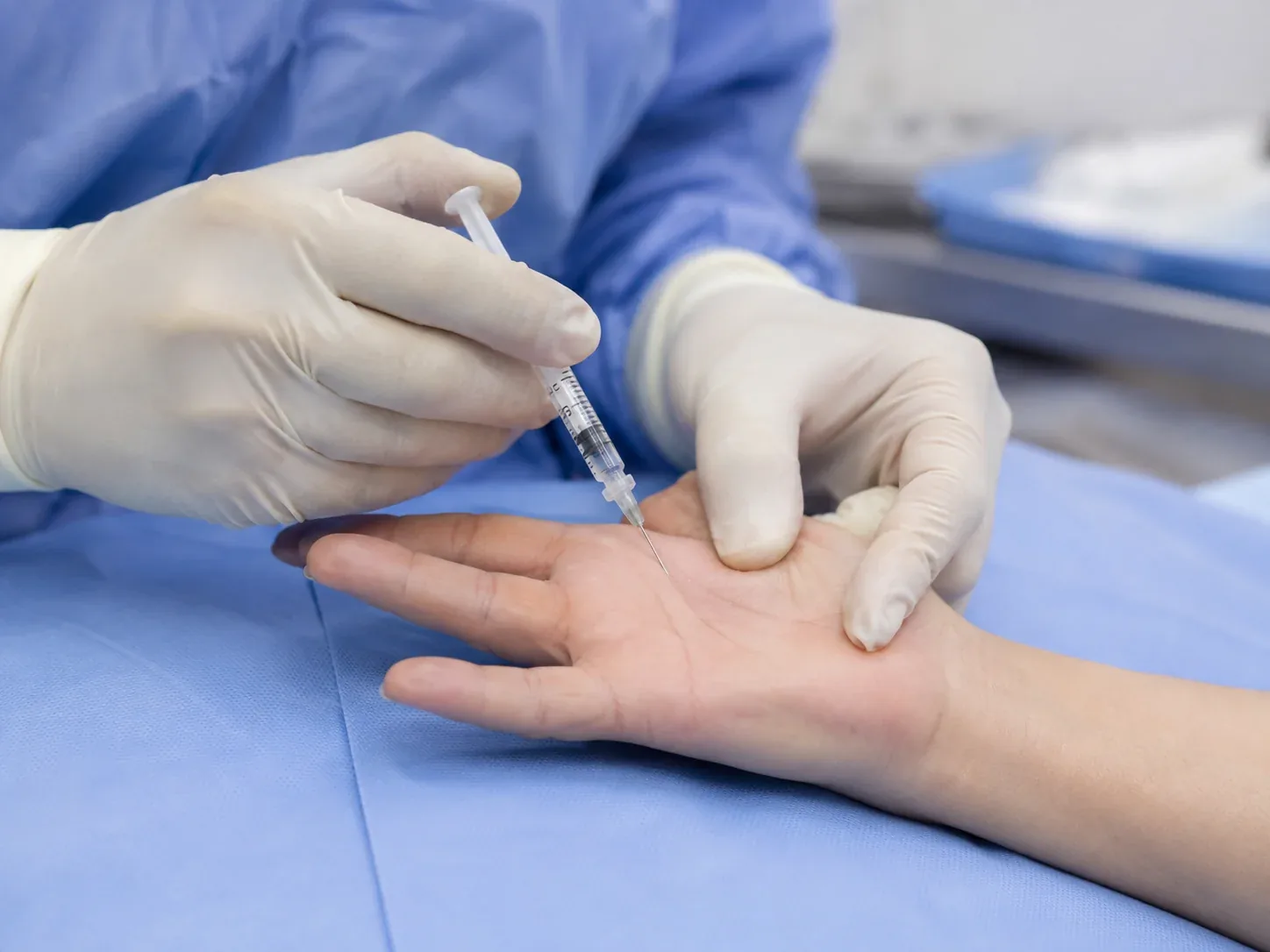 Trigger finger injection near the palm at the base of the affected finger
