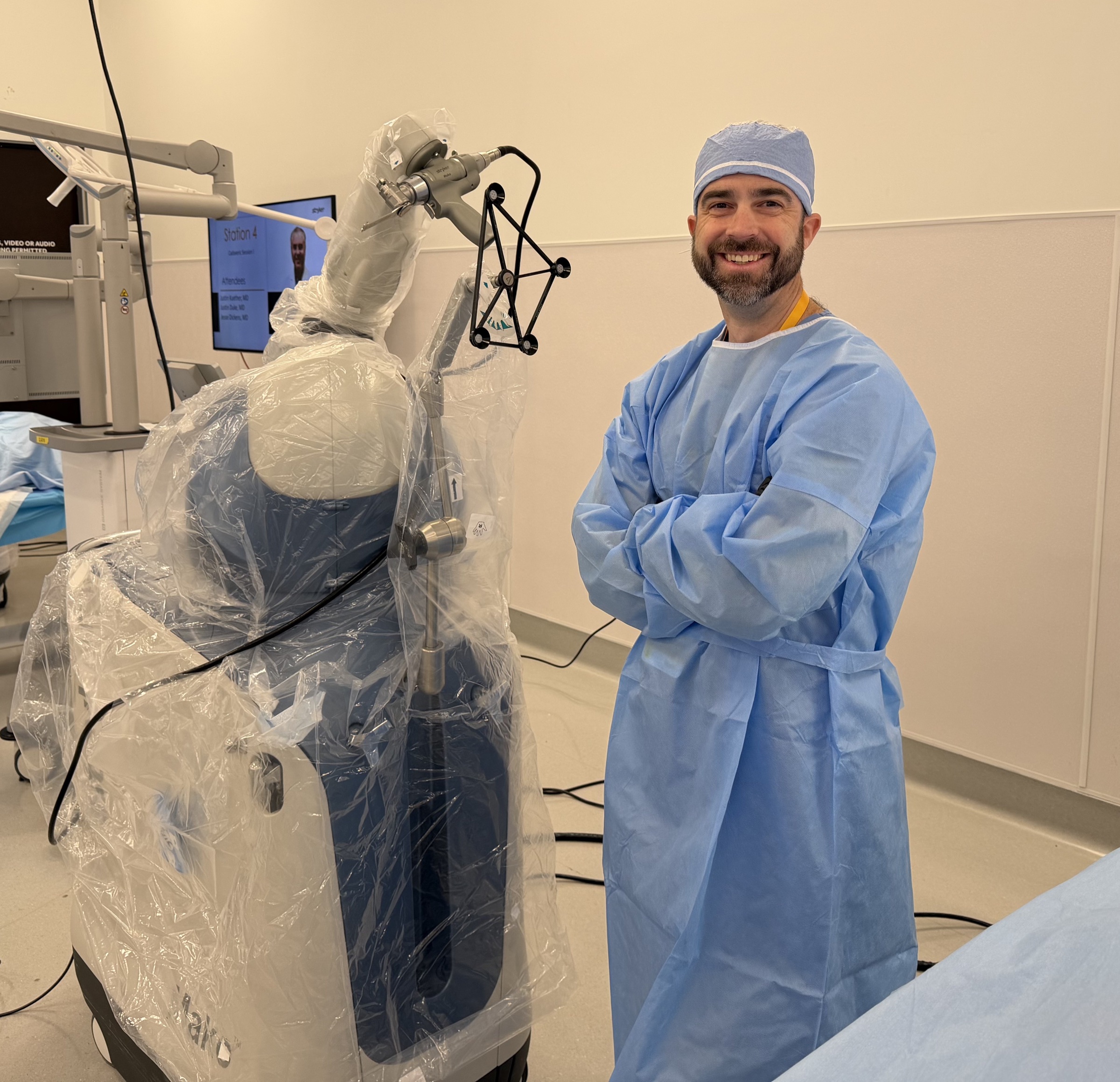 Dr. Barnes at the Mako robotic system in the operating room