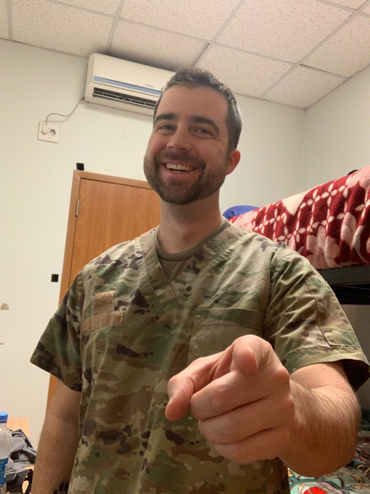 Dr. Barnes in deployed military surgical scrubs