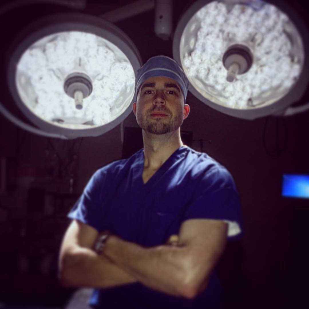 Dr. Barnes in the operating room under surgical lights