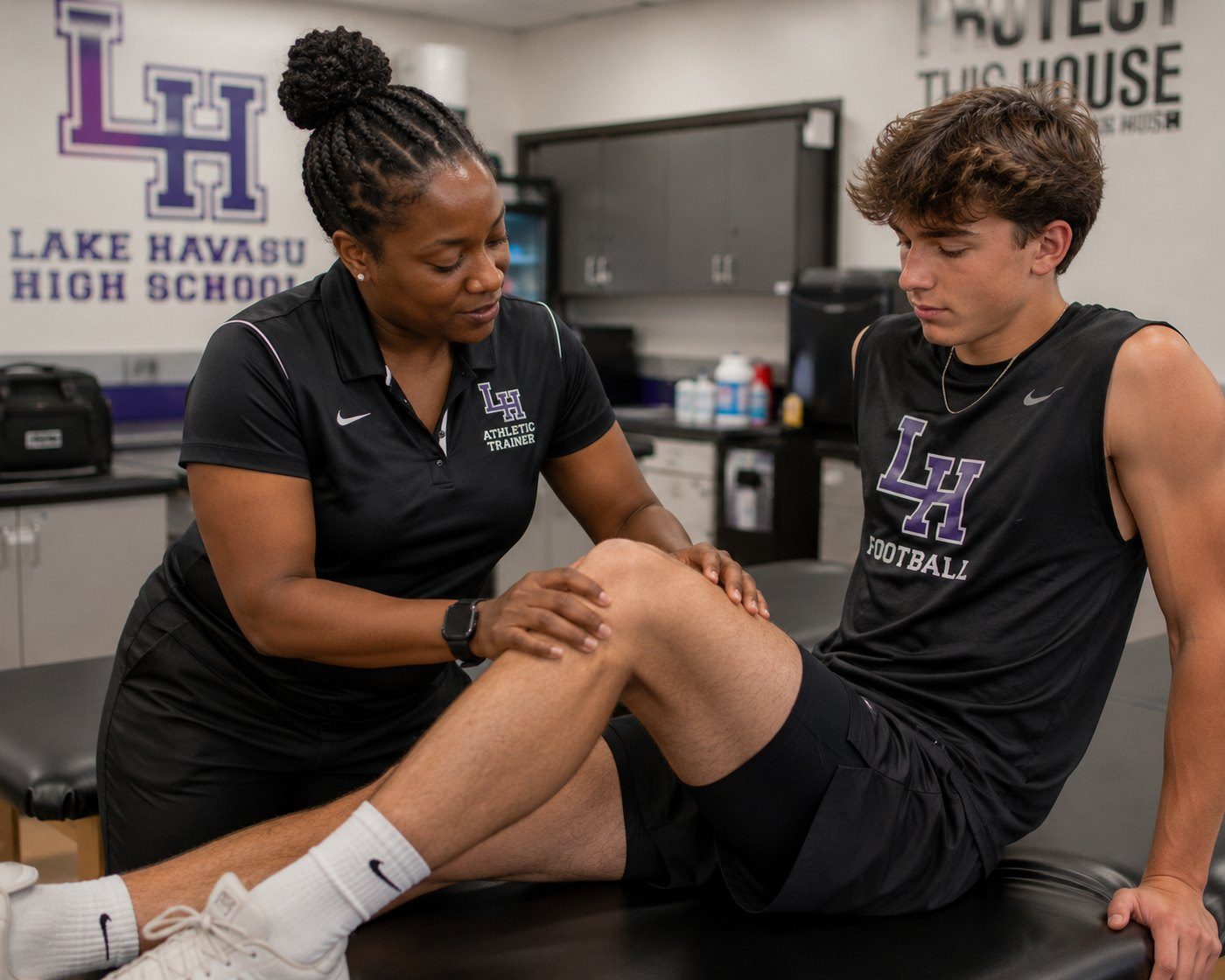 Athletic trainer evaluating a knee