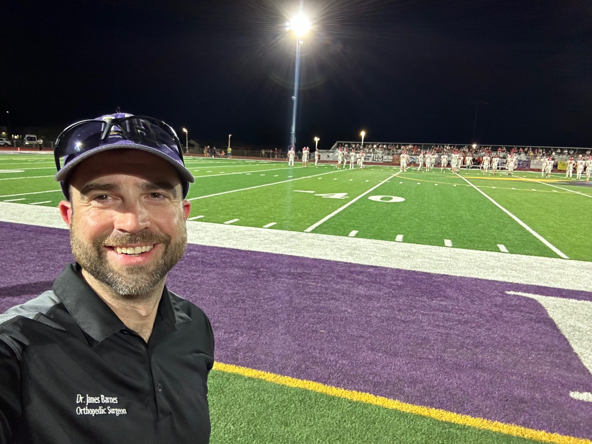 Dr. James Barnes providing sideline coverage at a Lake Havasu High School football game